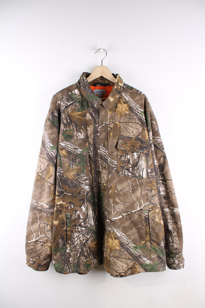 Carhartt forest / real tree camouflage heavy duty cotton jacket, features snap closures and bright orange quilted lining