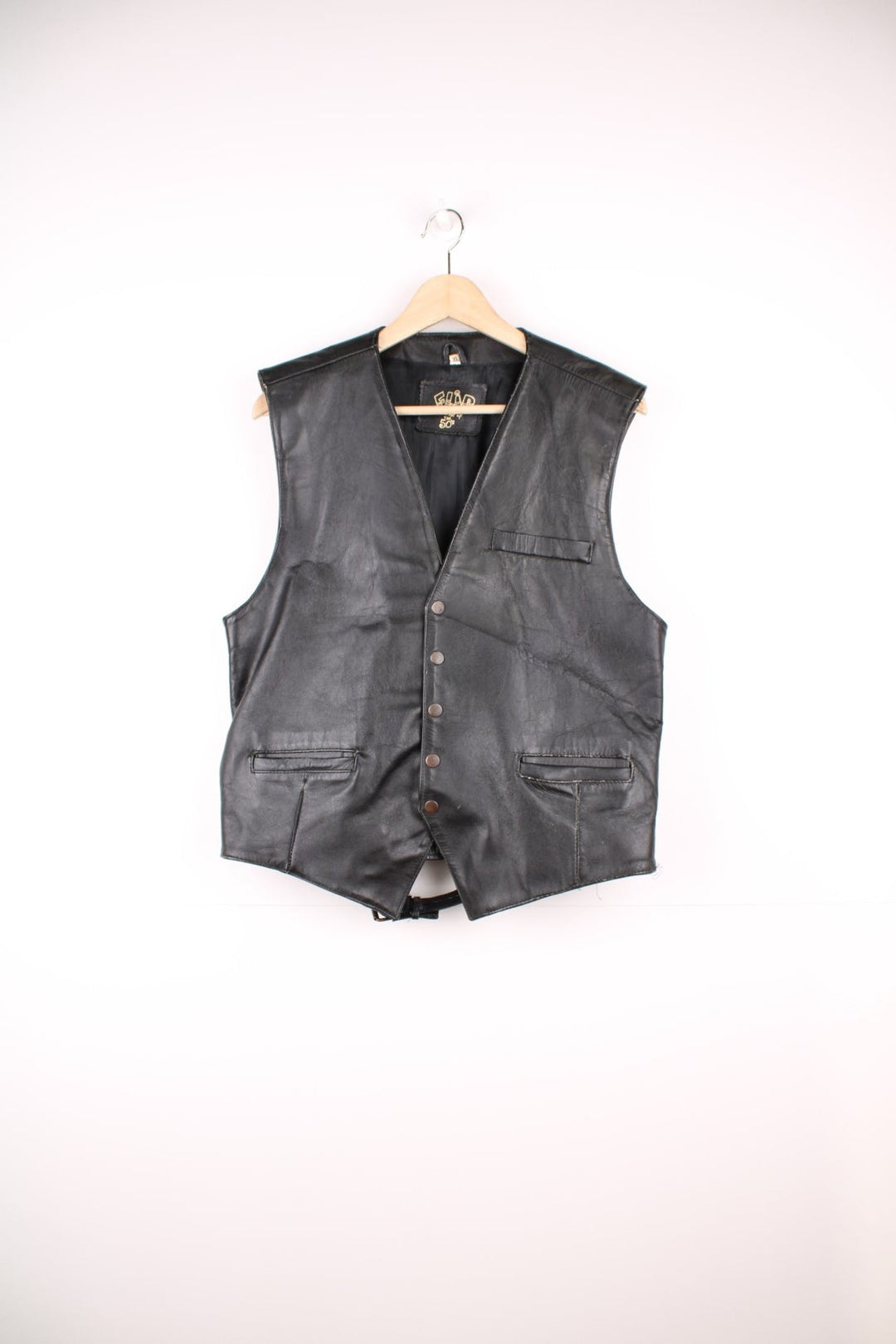 Flip 'The Spirit of the 50s' black leather vest with three pockets and snap closure.