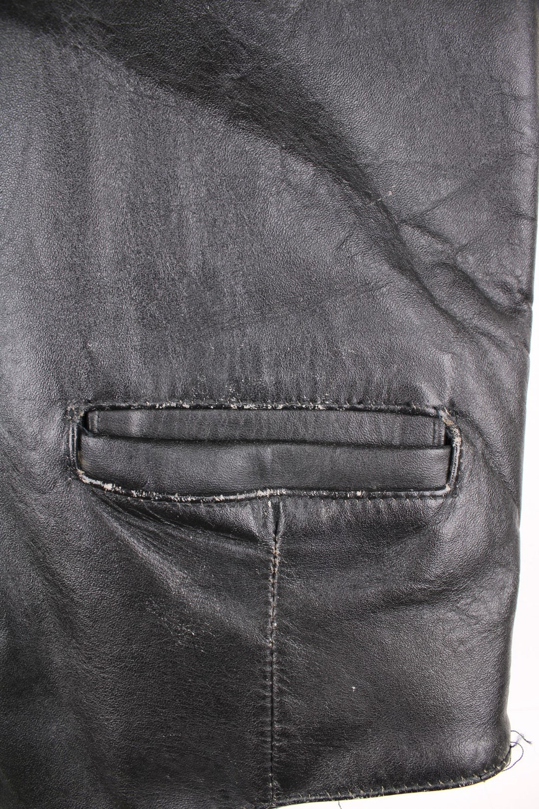 Flip 'The Spirit of the 50s' black leather vest with three pockets and snap closure.