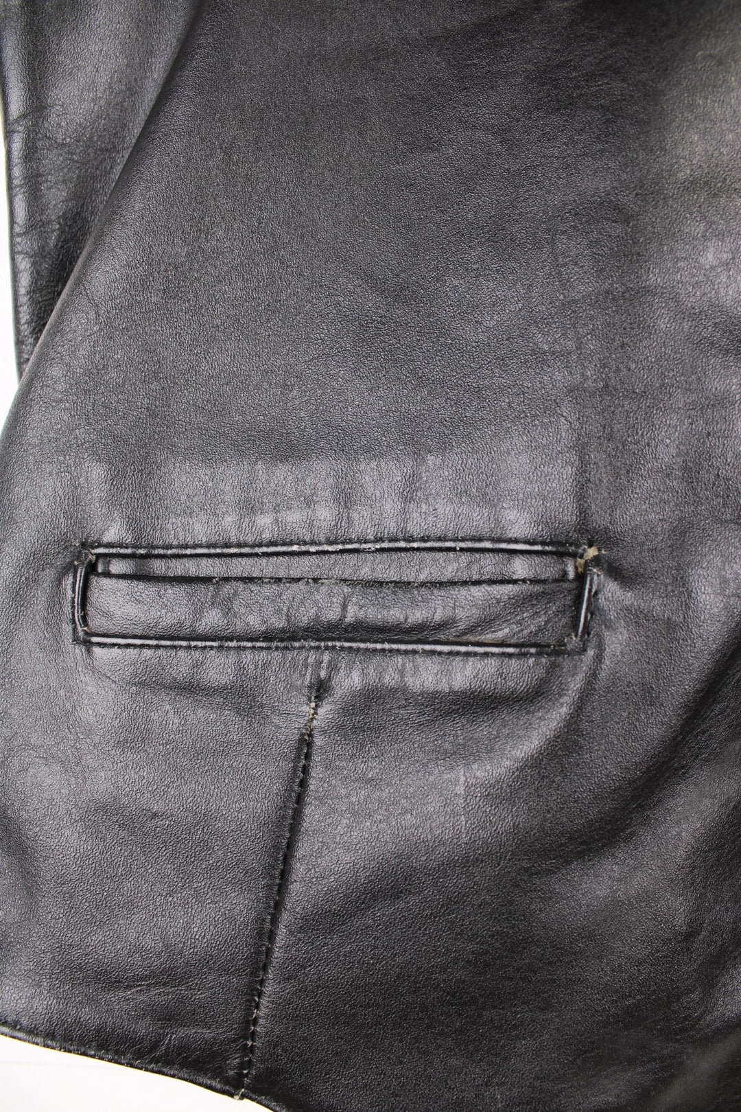 Flip 'The Spirit of the 50s' black leather vest with three pockets and snap closure.