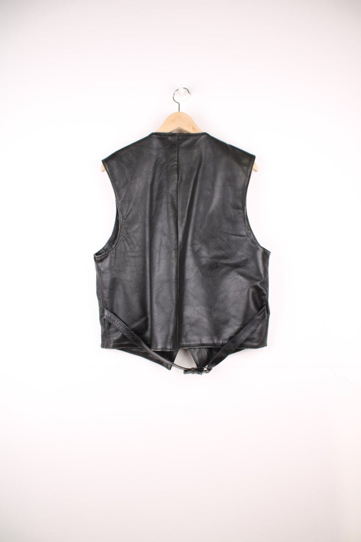 Flip 'The Spirit of the 50s' black leather vest with three pockets and snap closure.