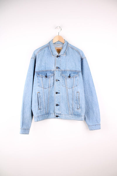 Vintage Hard Rock Cafe Orlando denim jacket with 'Save the Planet' slogan on the back, four front pockets, and branded button closure. 