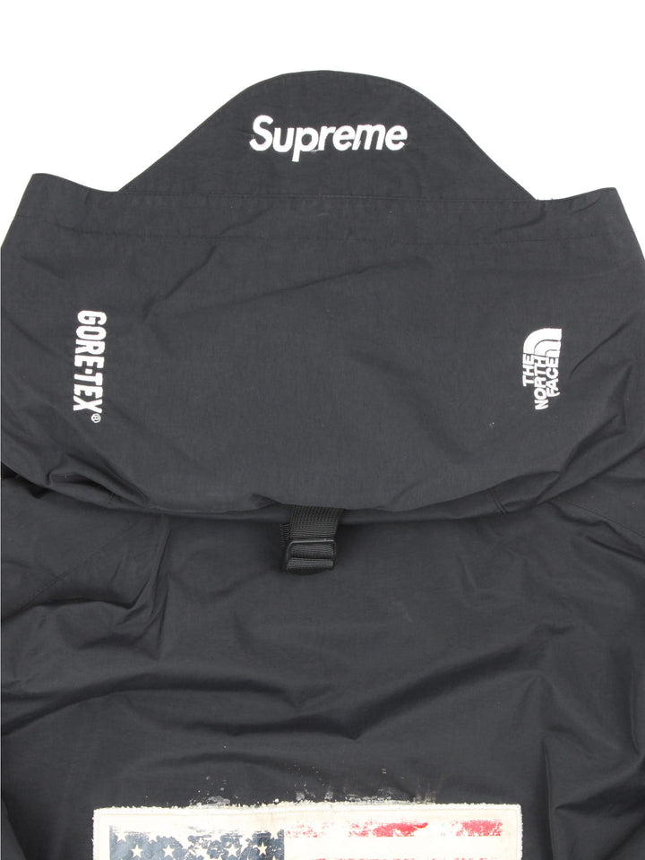 Supreme x The North Face Trans Antarctica expedition pullover jackets, features decorative patches featuring the US flag