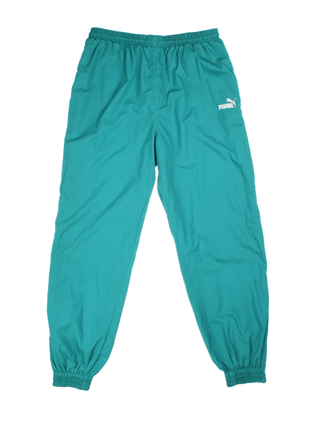 Puma Tracksuit Bottoms in green colourway with cuffed legs and two standard side pockets. Zip up leg with small classic logo on the front.