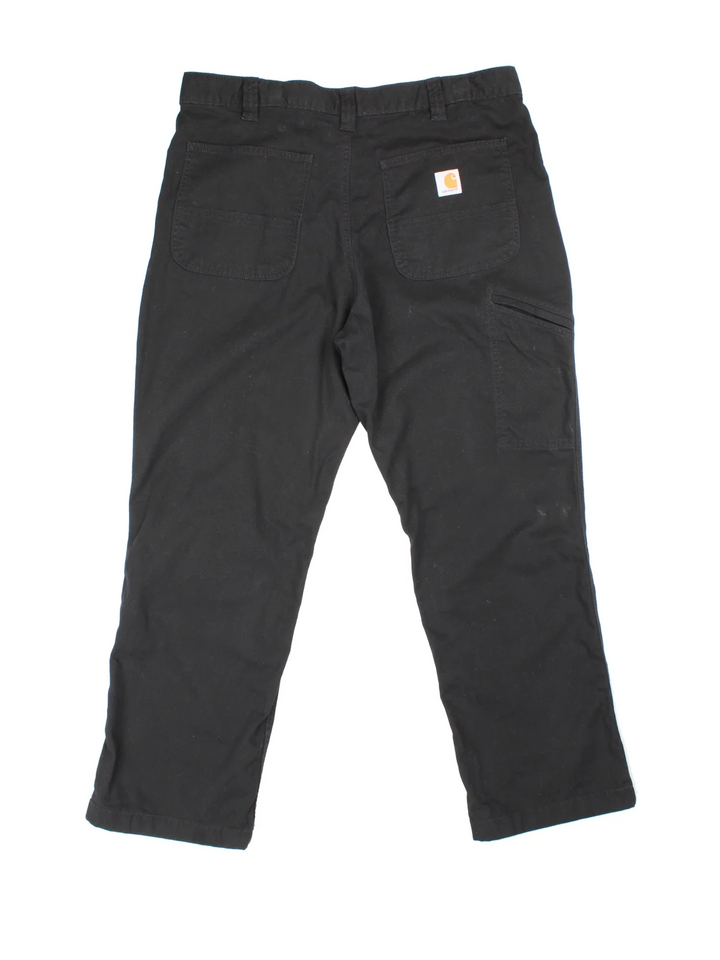 Carhartt Trousers in black colourway with multiple pockets and the logo embroidered on the back.
