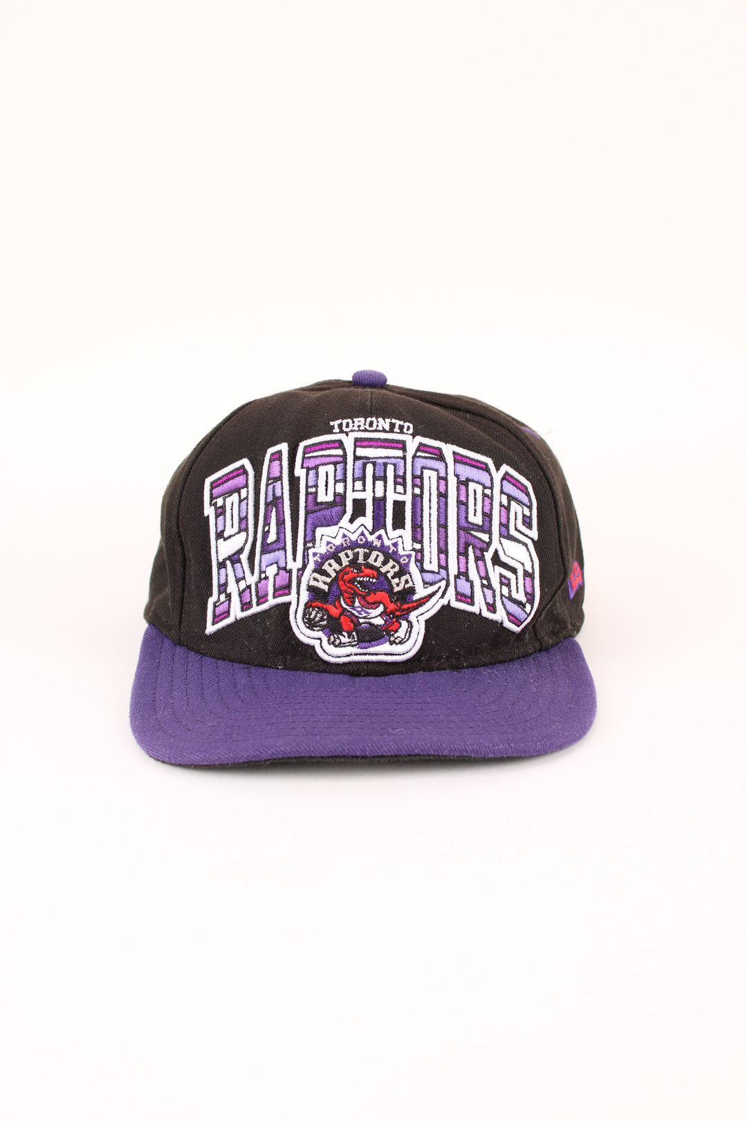 NBA Toronto Raptors New Era Snapback in a black and purple colourway with the logo embroidered on the front/back, and has adjustable snapback.