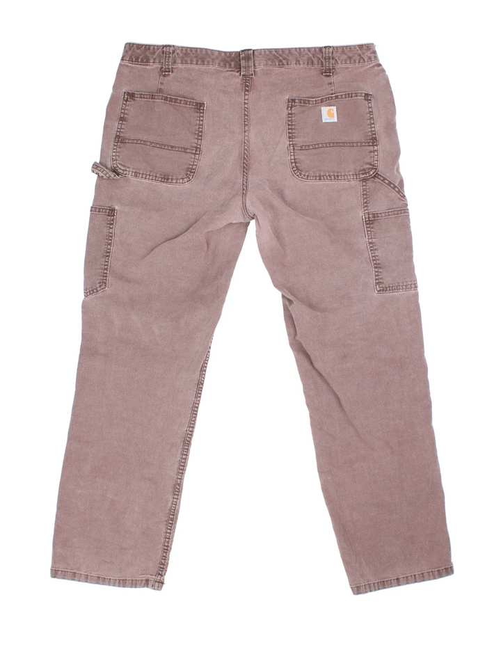 Carhartt Carpenter Trousers in a brown colourway with multiple pockets and the logo embroidered on the back.