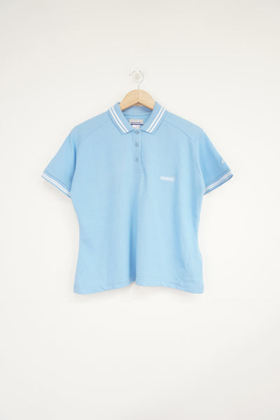 Baby blue Reebok polo shirt with embroidered logo on the chest