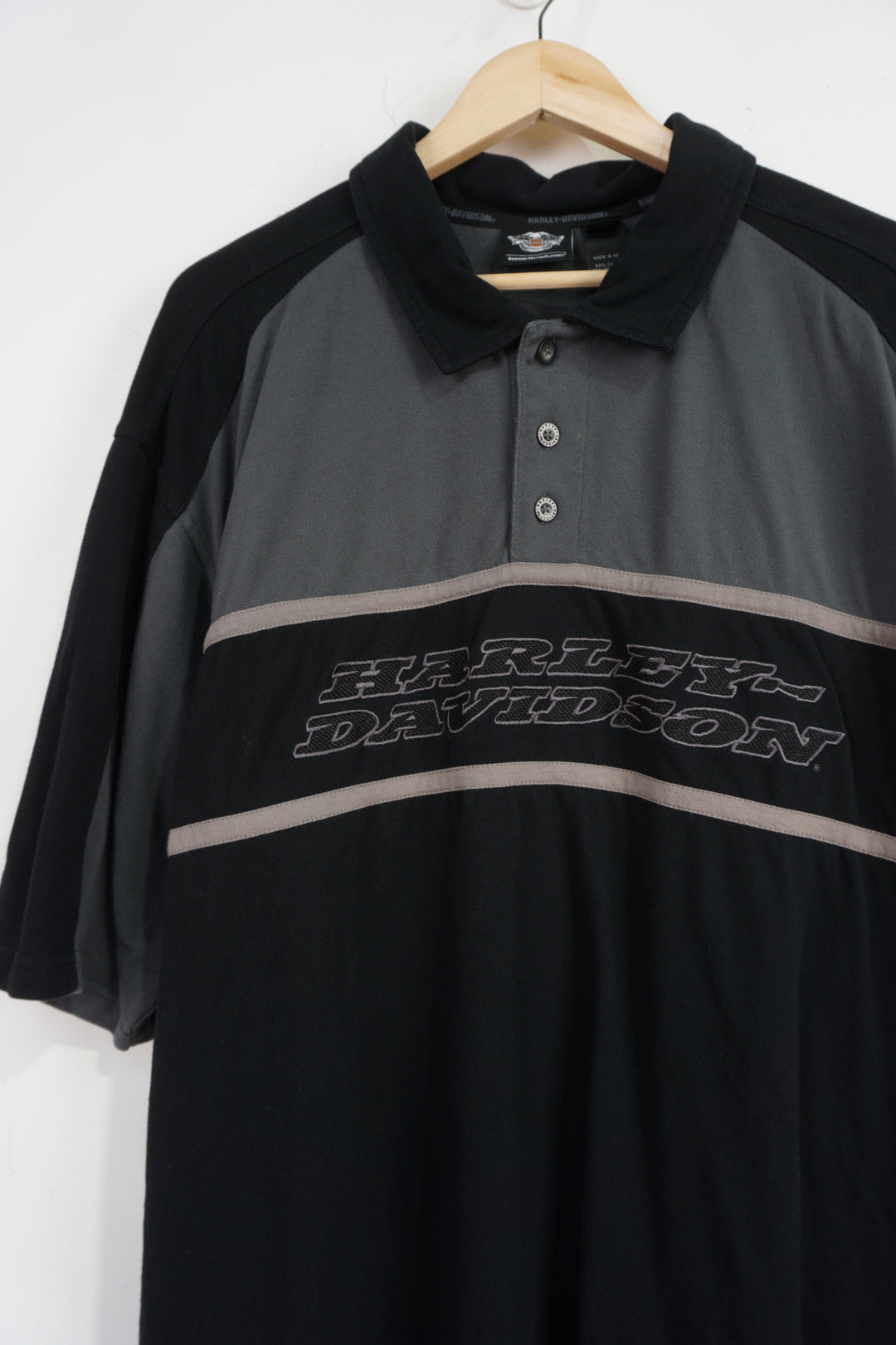 Harley Davidson black and grey polo shirt with embroidered spell-out logo on the front and back