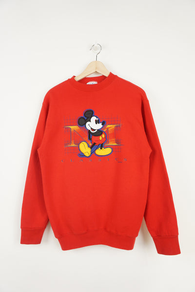 Vintage 90's Disney's red  crewneck sweatshirt with embroidered Mickey Mouse graphic on the front 