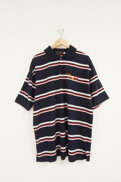 Vintage Coogi navy blue, striped polo shirt with embroidered logo on the chest