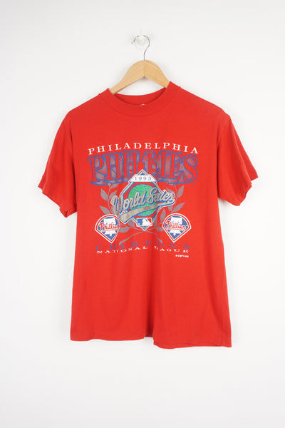 Vintage MLB Philadelphia Phillies red t-shirt with printed World Series champions graphic on the front. Made in 1993 with single stitch seams.  good condition