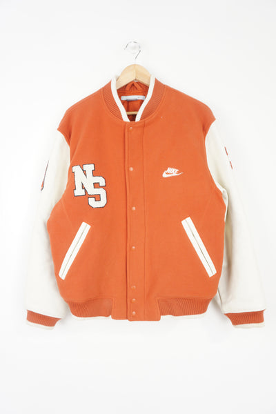 Vintage Nike Oregon orange and white fleece varsity jacket with leather sleeves and embroidered spell-out details