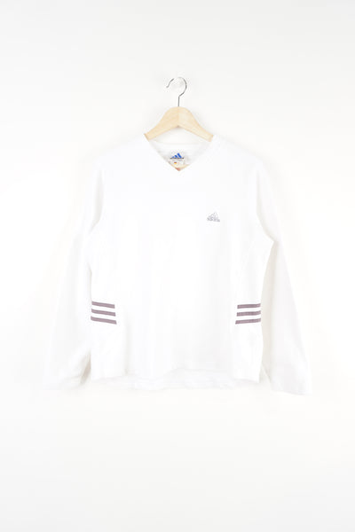 Adidas white sweatshirt features embroidered logo on the chest and signature three stripes on the side 