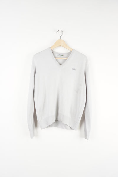 Vintage Lacoste light grey and v-neck jumper features signature embroidered logo on the chest