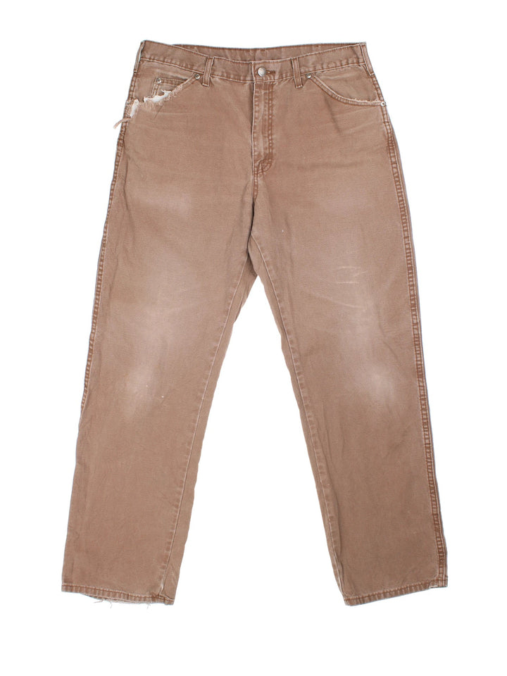 Dickies Carpenter Jeans in brown colourway with multiple pockets and the logo embroidered on the back.