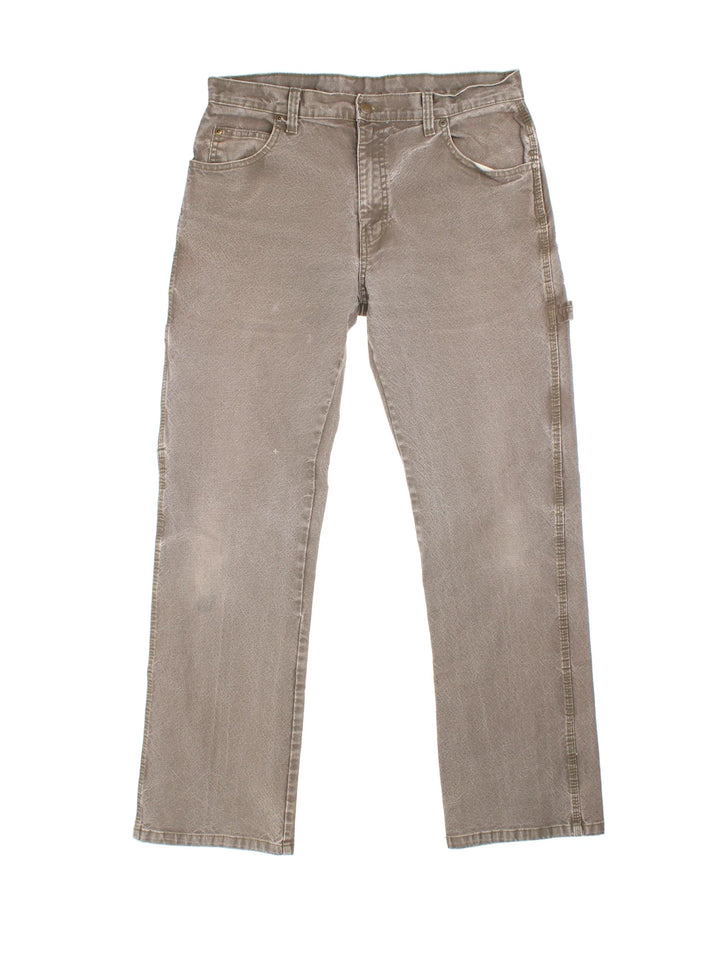 Dickies Carpenter Jeans in brown colourway with multiple pockets and the logo embroidered on the back.