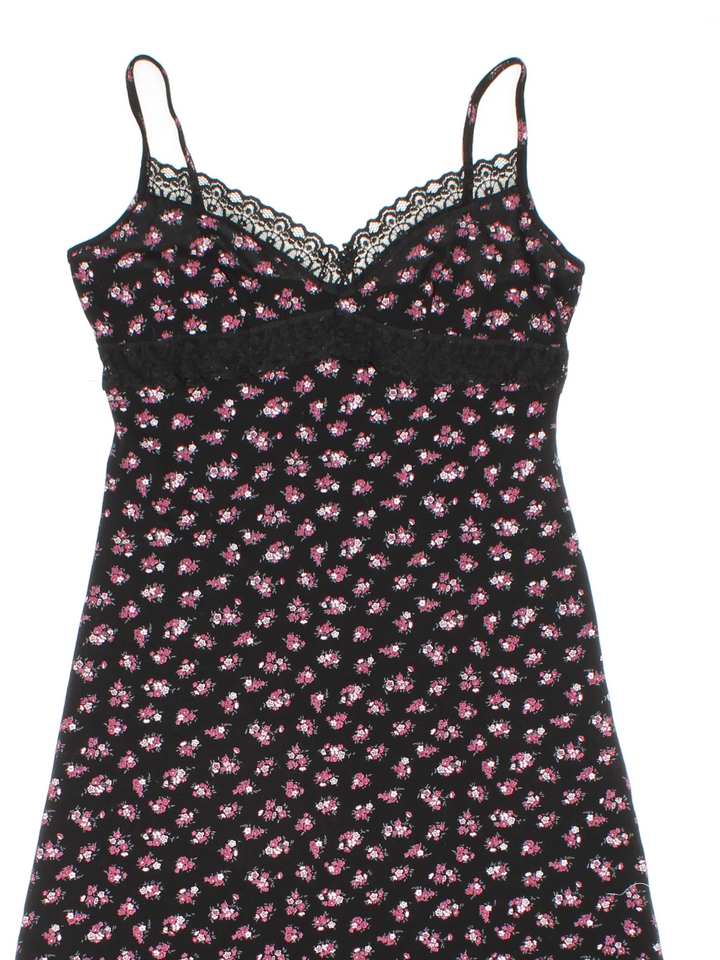 Vintage Y2K Ditsy Floral Mini Dress in black/pink colourway with frill hemline and lace bust detail.