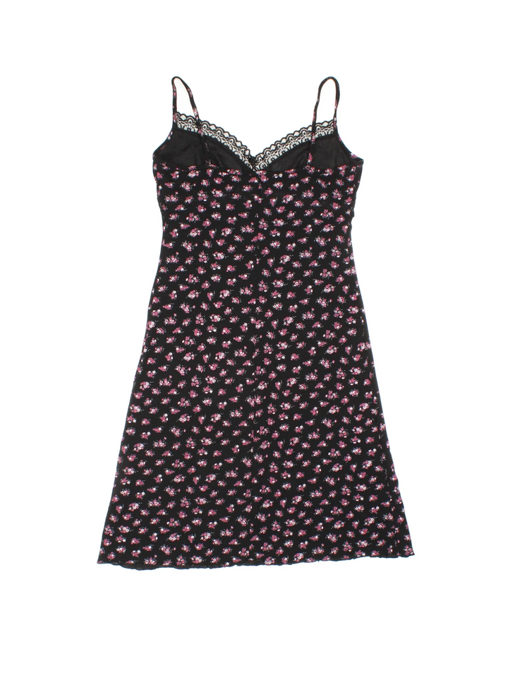 Vintage Y2K Ditsy Floral Mini Dress in black/pink colourway with frill hemline and lace bust detail.