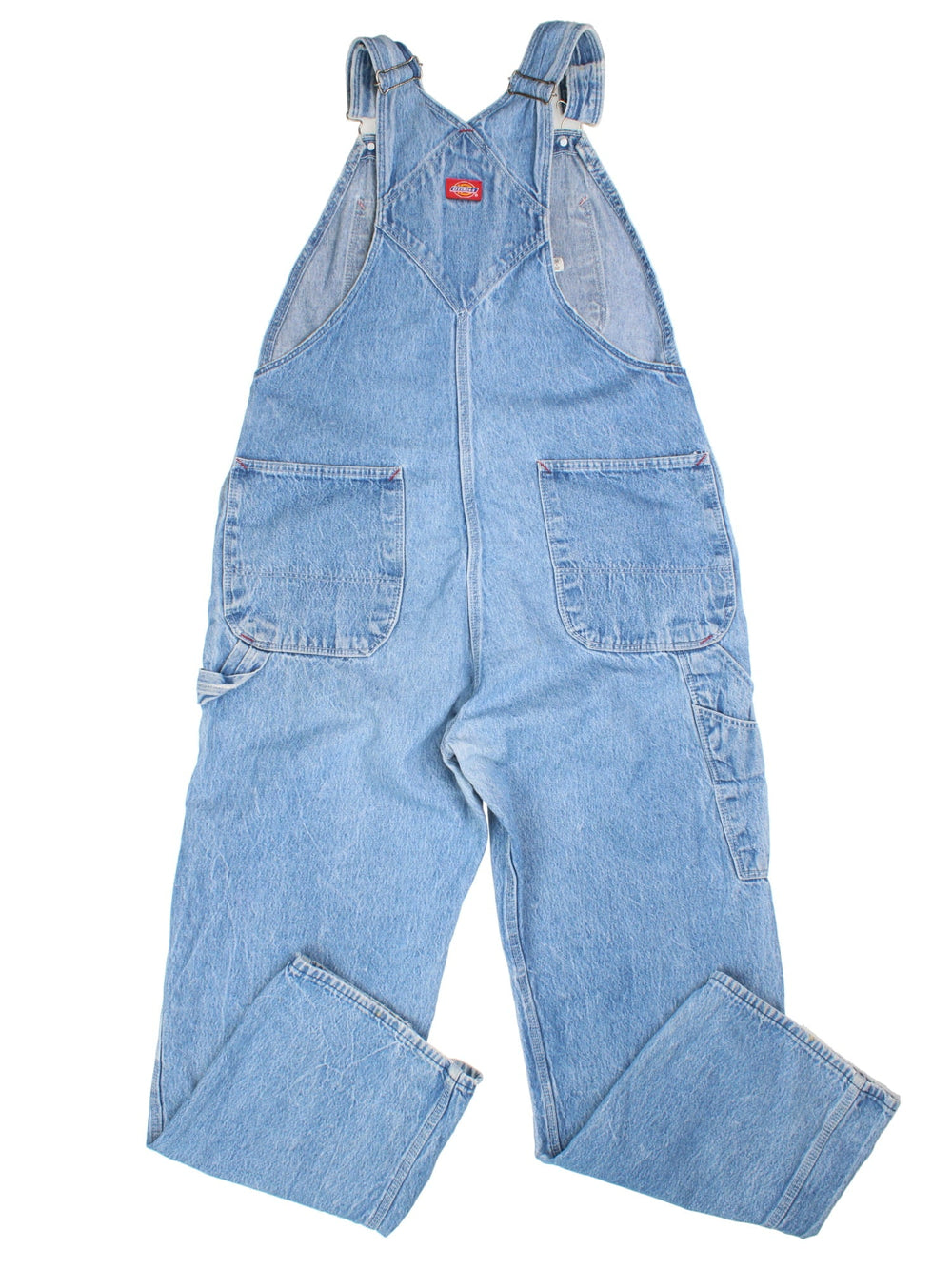Dickies Dungarees in blue colourway with multiple pockets, adjustable straps, and has the logo embroidered on the front.