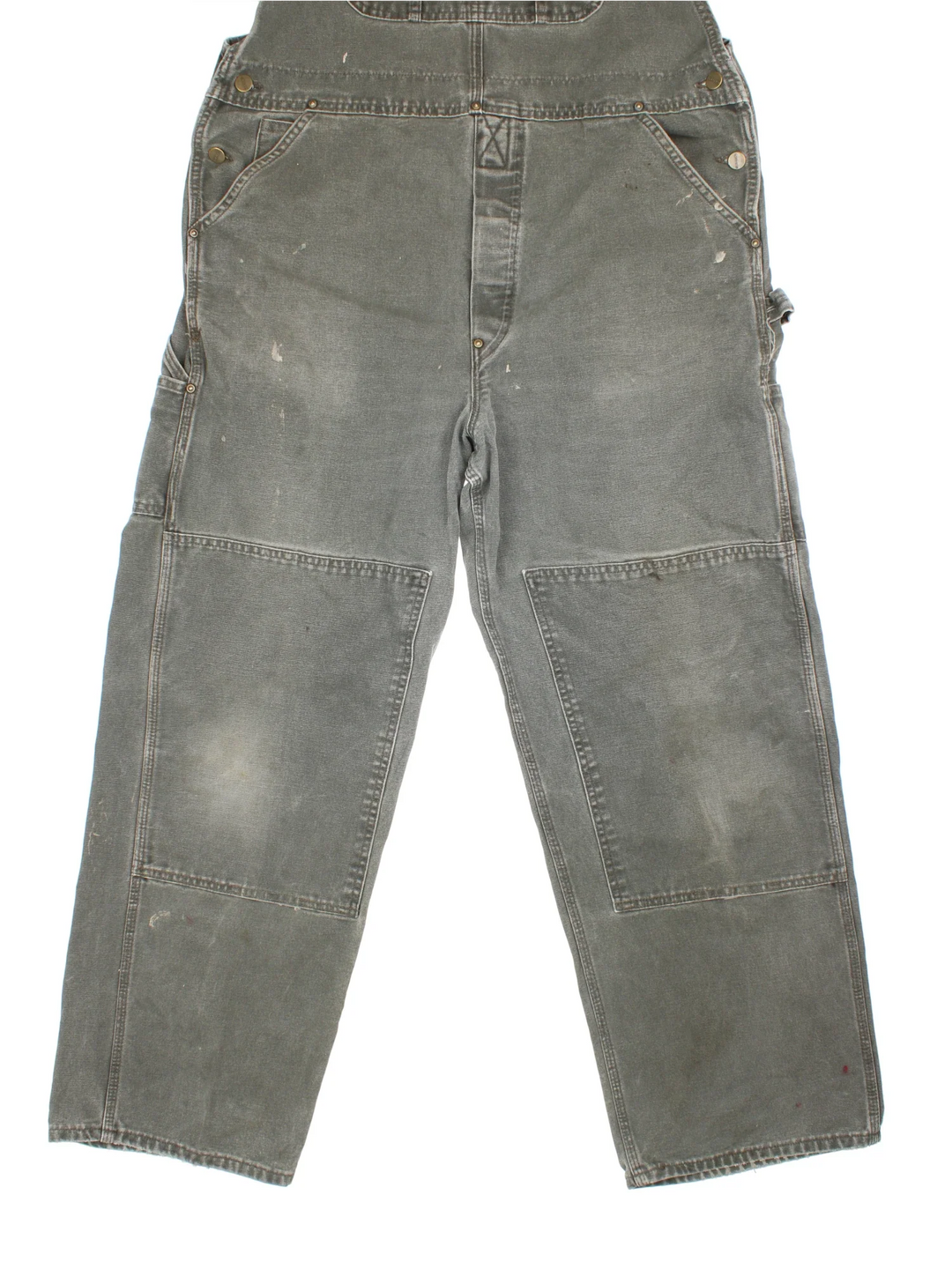 Carhartt Dungarees in green colourway with multiple pockets, adjustable straps and the logo embroidered on the front.