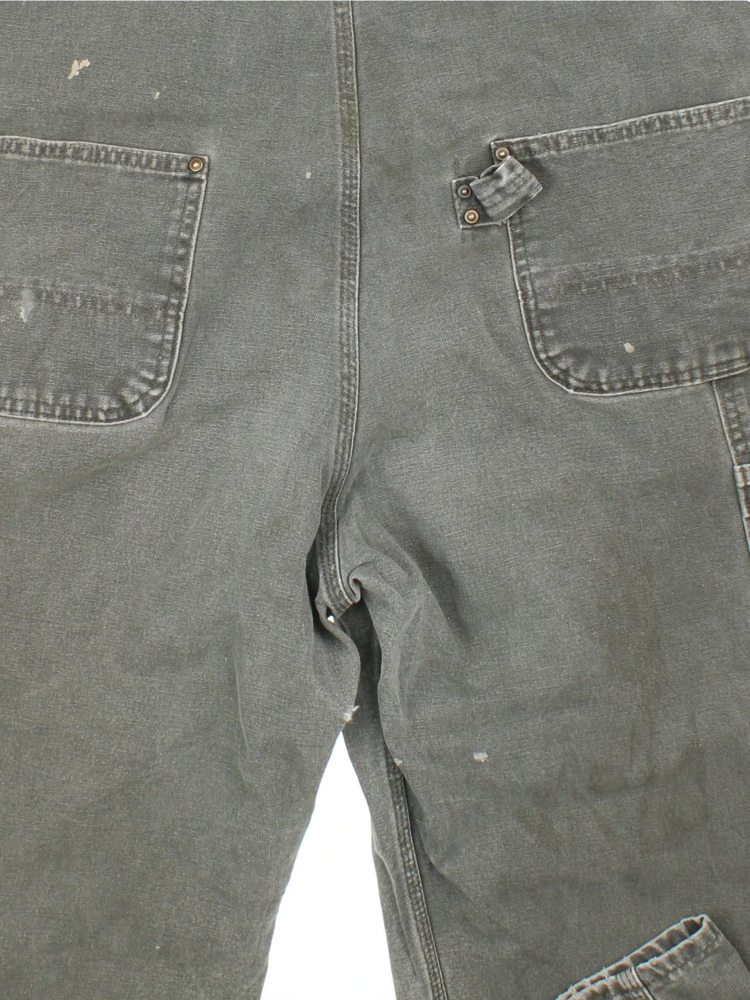 Carhartt Dungarees in green colourway with multiple pockets, adjustable straps and the logo embroidered on the front.