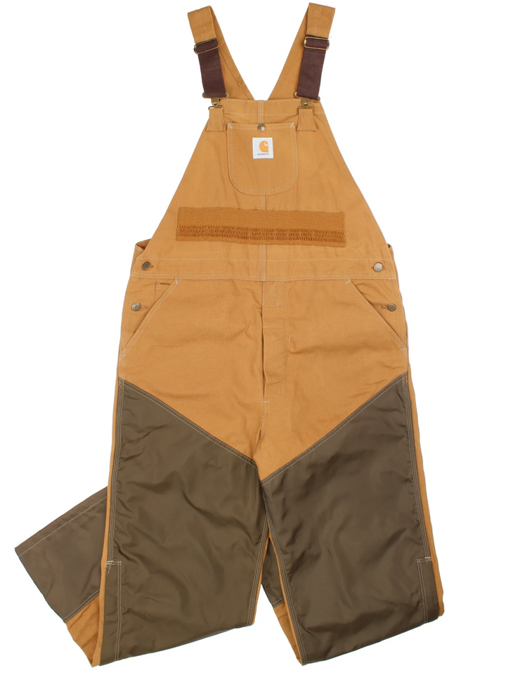 Carhartt Dungarees in tan colourway with multiple pockets, adjustable straps and the logo embroidered on the front.