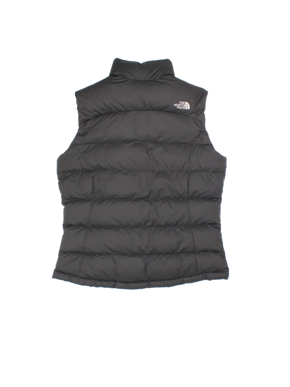 The North Face Gilet in a black colourway. Full zip with two front pockets and small classic logo on the front.