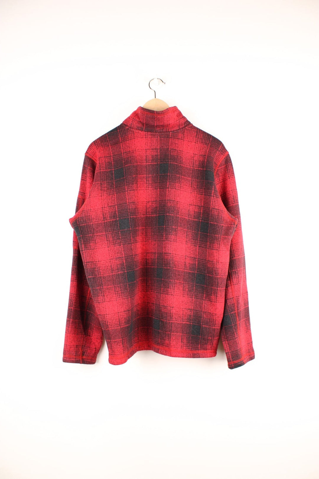 The North Face red and black check fleece with 1/2 zip closure and a white logo patch.