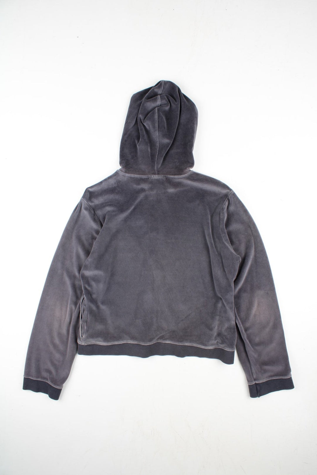 Vintage Reebok Velour Hoodie in a grey colourway. Zip up fastening with side pockets, branding embroidered on front.