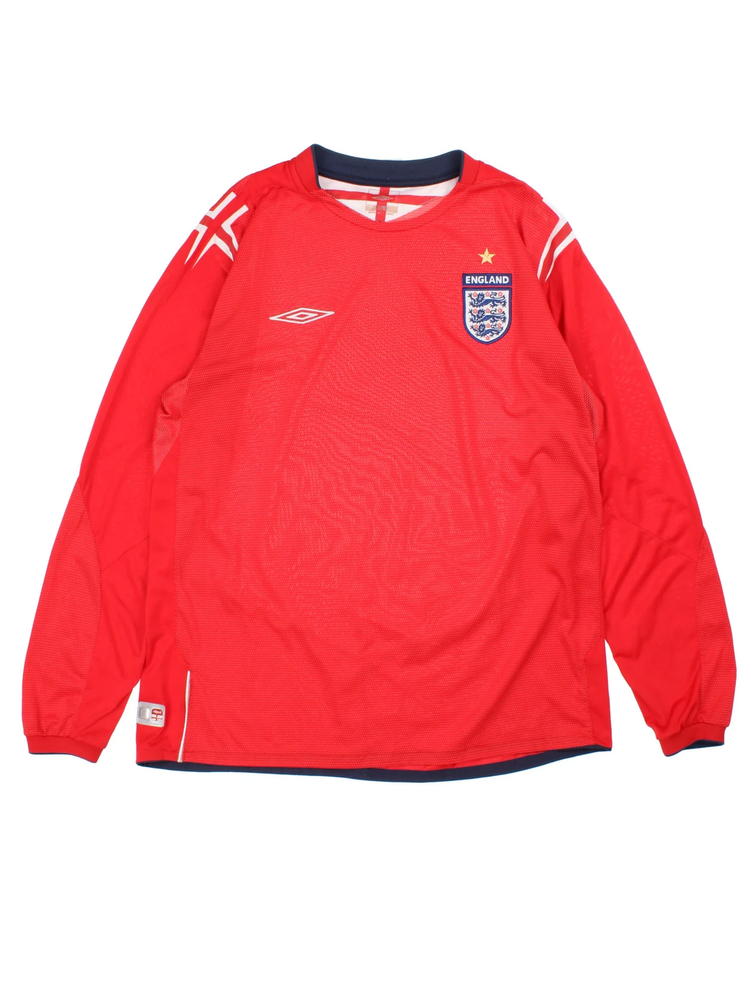 England 2004/06 Umbro Football Shirt in the red away kit colourway, features long sleeves, printed logos and badge on the front.