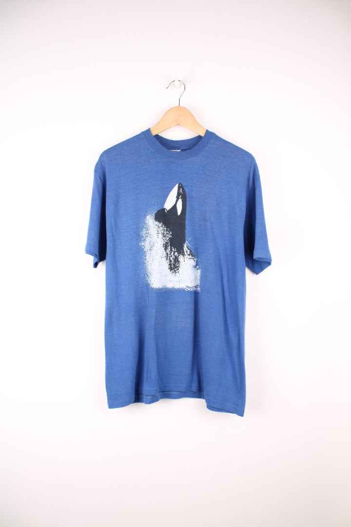 1980s SeaWorld orca graphic tee in blue.