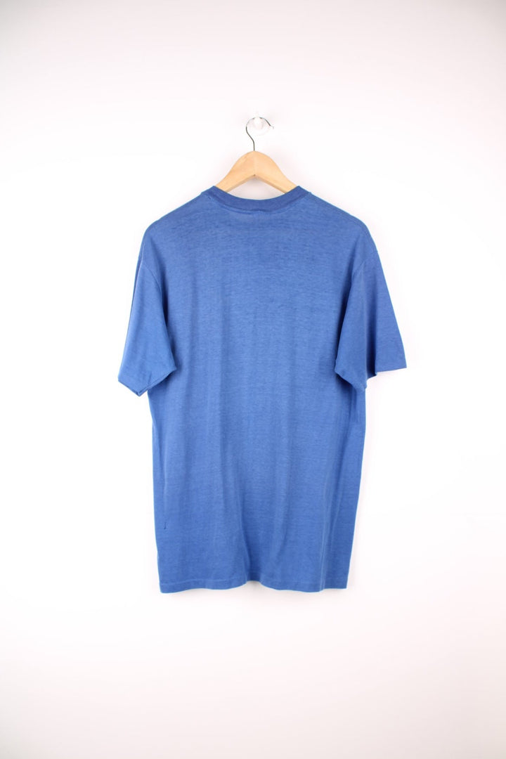 1980s SeaWorld orca graphic tee in blue.