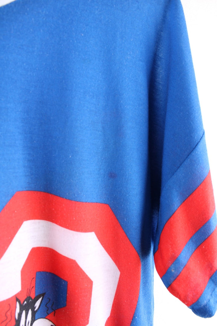 Vintage 1980s Jodie Arden Pyjama shirt in a blue colourway. There is a large graphic printed on the front, with Sylvester and Tweety and the sleeves are sports jersey style with a single stitch hem.
