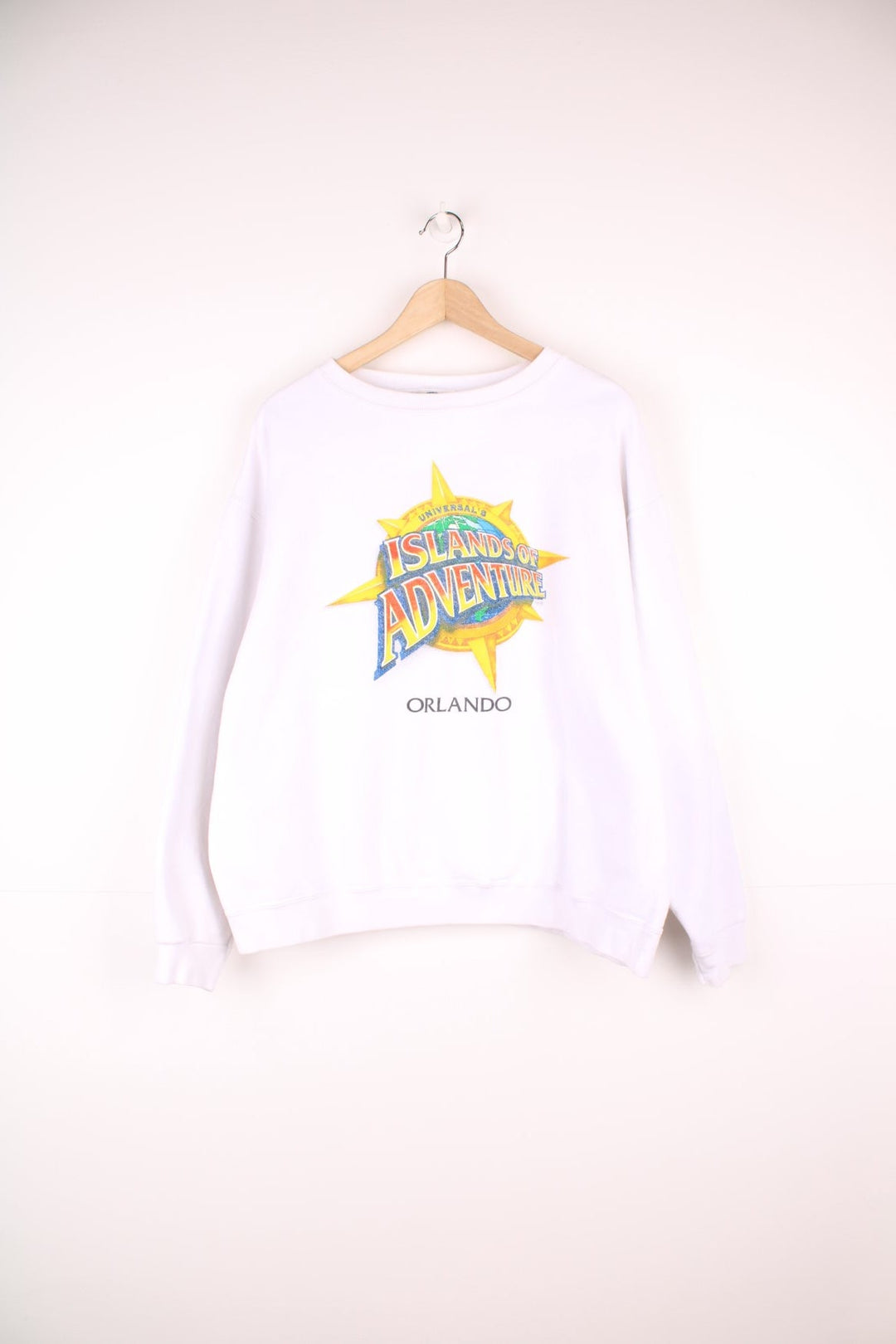 Vintage Universal Studios, Islands Of Adventure Orlando Sweatshirt in a white colourway with the logo printed on the front.