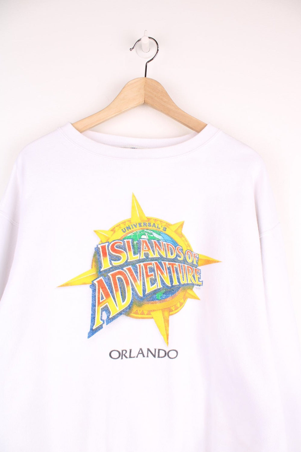 Vintage Universal Studios, Islands Of Adventure Orlando Sweatshirt in a white colourway with the logo printed on the front.
