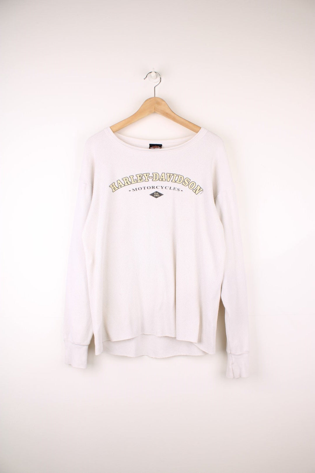 2001 Harley-Davidson, Daytona Beach, Florida long sleeved top in an off white/light beige colourway. Features printed spell out logo across the chest and graphic print on the back.