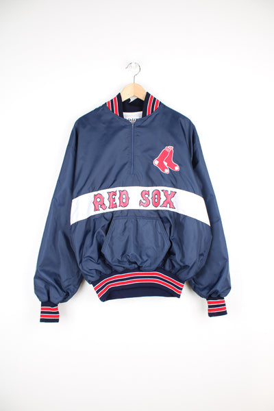 Vintage MLB Boston Red Sox Pullover Windbreaker in a blue, white and red colourway, half zip with a big pouch pocket, and has the logo embroidered on the front as well as the spell out printed below.