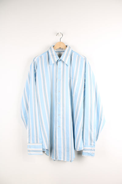 Vintage 70's blue and white striped button up shirt. Has a dagger collar and also printed info about the shirt at the bottom. 