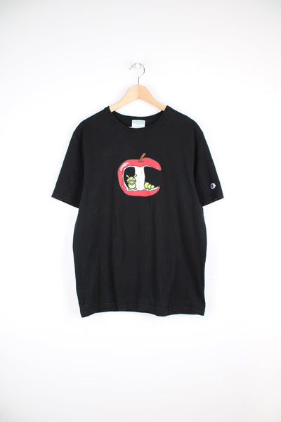Champion t-shirt in black with playful apple core and worm graphic on the front