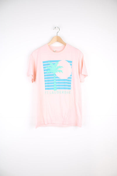 Vintage single stitch T-Shirt in pink with graphic palm tree print on the front.