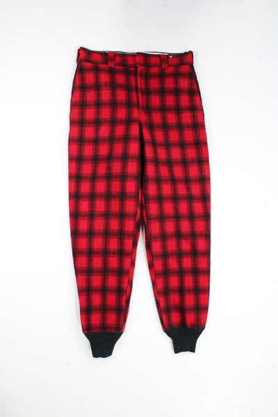  Vintage 60's Woolrich hunting trousers. Red check wool trousers with elasticated cuffs and quilted lining.   good condition - one small mark on the leg (see photos)  Size in Label:  Mens 32 (M)  Our Measurements:  Waist: 33 inches  Leg Inseam: 32 inches
