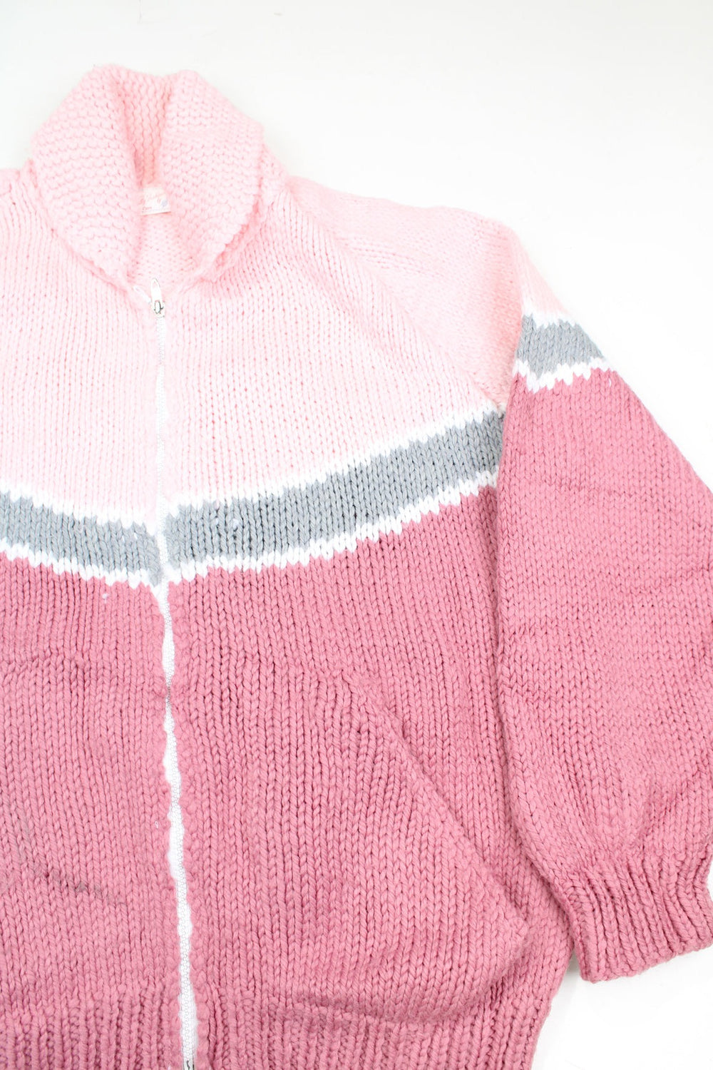 Vintage hand made pink and grey striped knit, zip through cardigan with pockets. Has a really charming label with previous owners name on