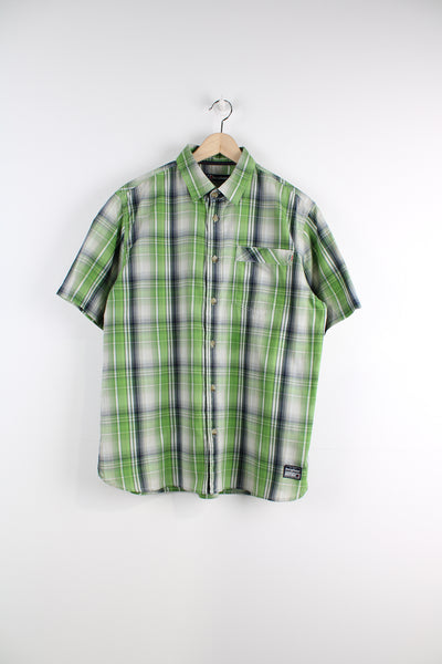 Berghaus Short Sleeved Plaid Shirt in a green, white and blue colourway, button up with a chest pocket, and logo embroidered on the bottom.