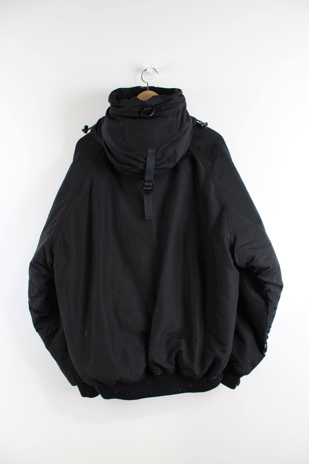 All black Diesel real down bomber style puffer jacket with multiple pockets and removable fur trim hood.