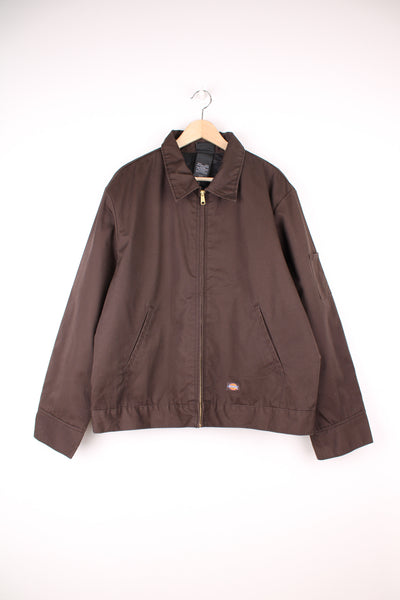 Dickies Eisenhower Workwear Jacket in a brown colourway, zip up with side pockets, quilted lining and has the logo embroidered on the front.
