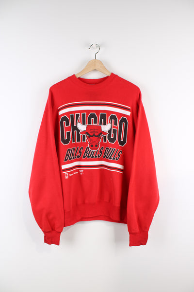 Vintage 90's Chicago Bulls NBA sweatshirt in red, has big logo graphic design across the front.