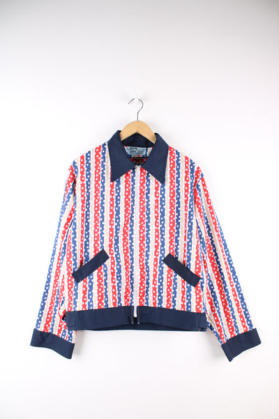 True vintage made in the USA 1970's cotton zip through jacket, features all over stars and stripes print and dagger collar