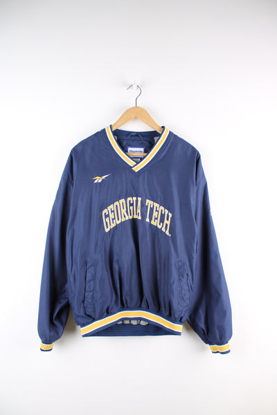 Vintage Reebok, Georgia Tech University sports drill top, blue and yellow team colourway, v neck, side pockets, embroidered logos on the front and back.