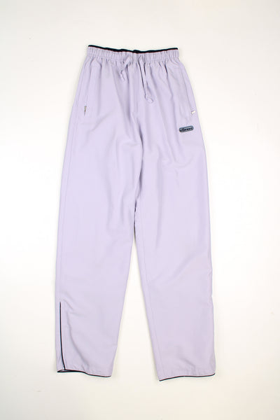 Vintage Ellesse tracksuit bottoms in a purple colourway, elasticated waist, pockets and has logo embroidered on the front.